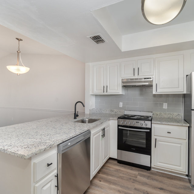 The Park at Murano - Kitchen with Countertops and Stainless Steel Appliances