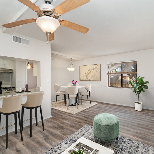 The Park at Murano - Living Room with Ceiling Fan and Dining Area